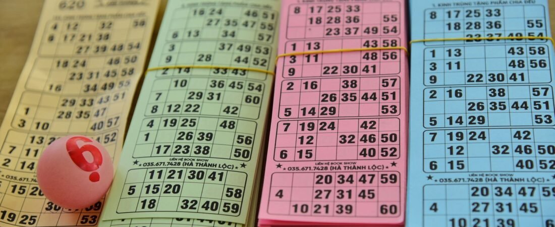 Bingo cards and a numbered ball set up for game night, similar to 40 and 8 Bingo at American Legion Post 51 in Lebanon, Oregon