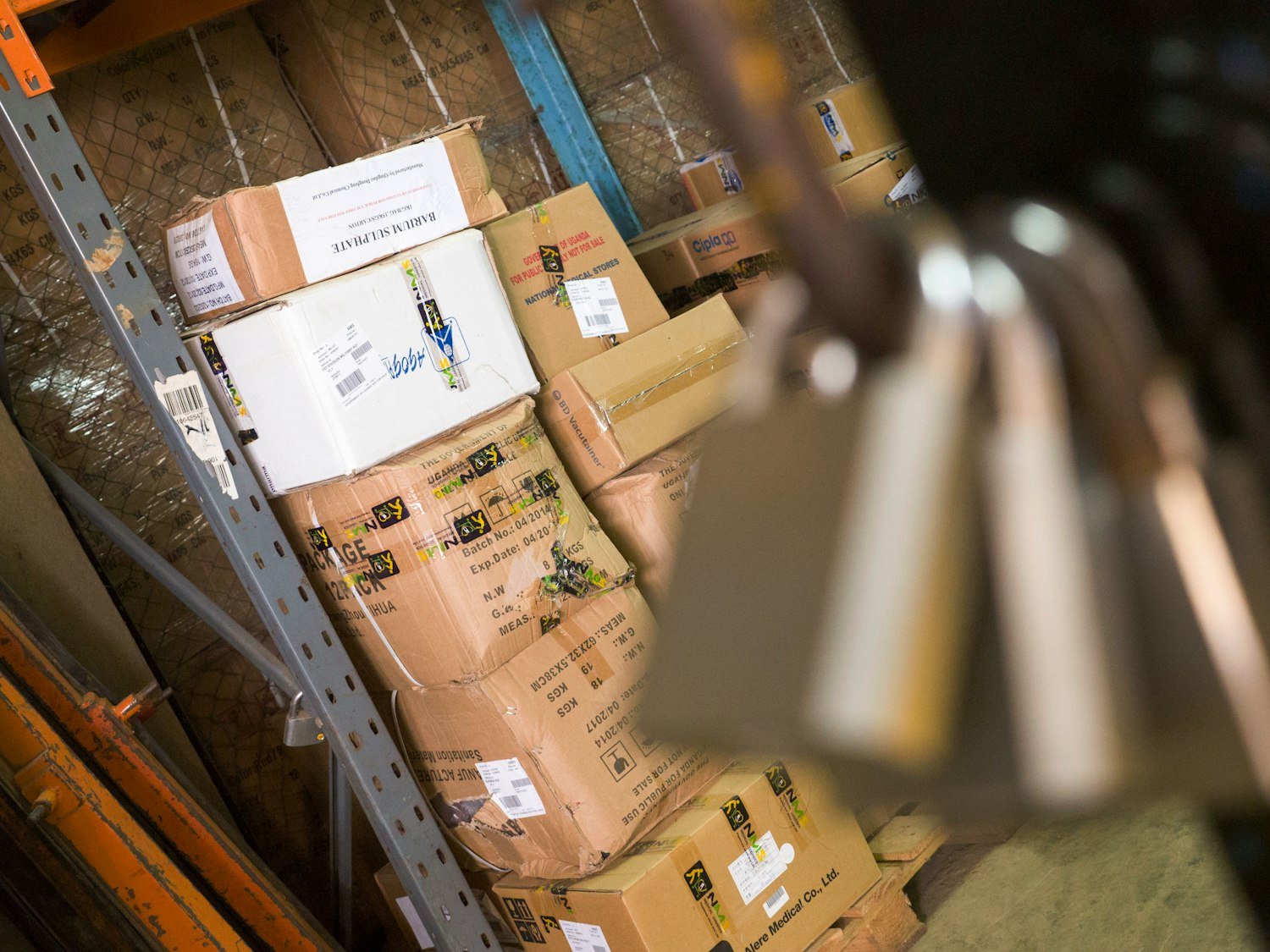 Stacked cardboard boxes, representing the lifting work that strains a service-connected back