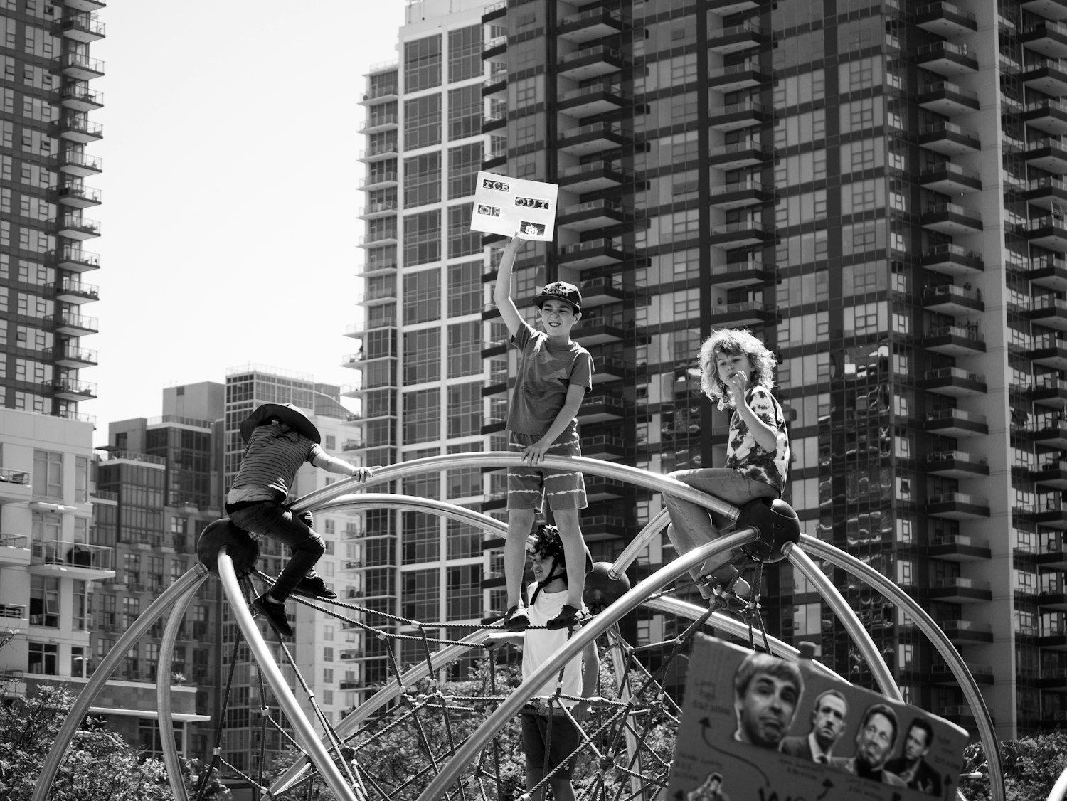 Children on playground equipment, representing the Children & Youth pillar