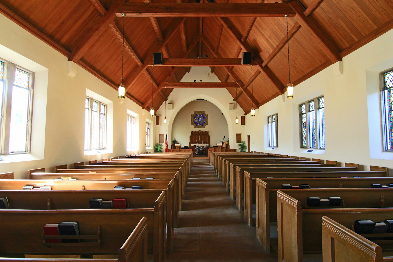 A church interior with pews, a common setting for a memorial service