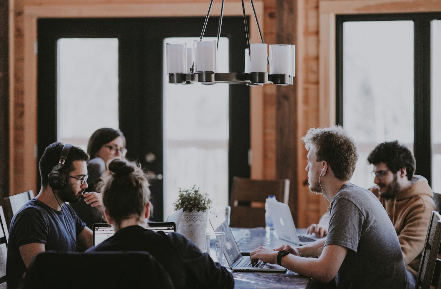 Colleagues working together around a table in an office