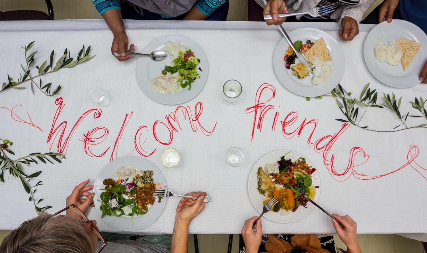 Community members sharing a meal together, similar to Club 51's canteen menu available during bingo nights