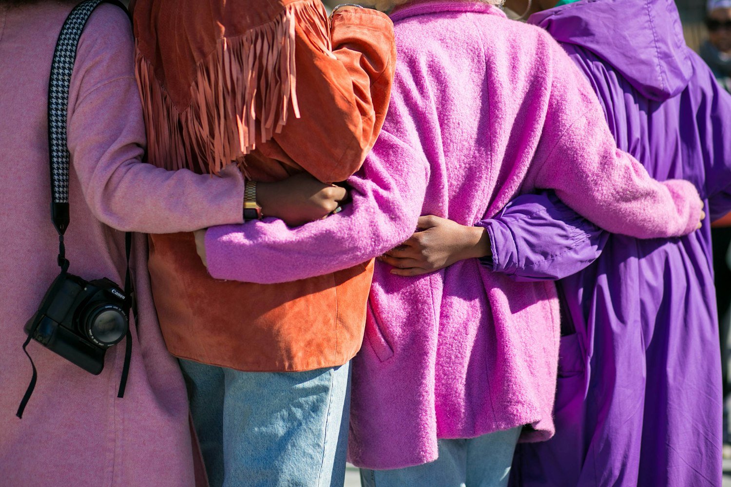 People standing together in support of one another in a community setting