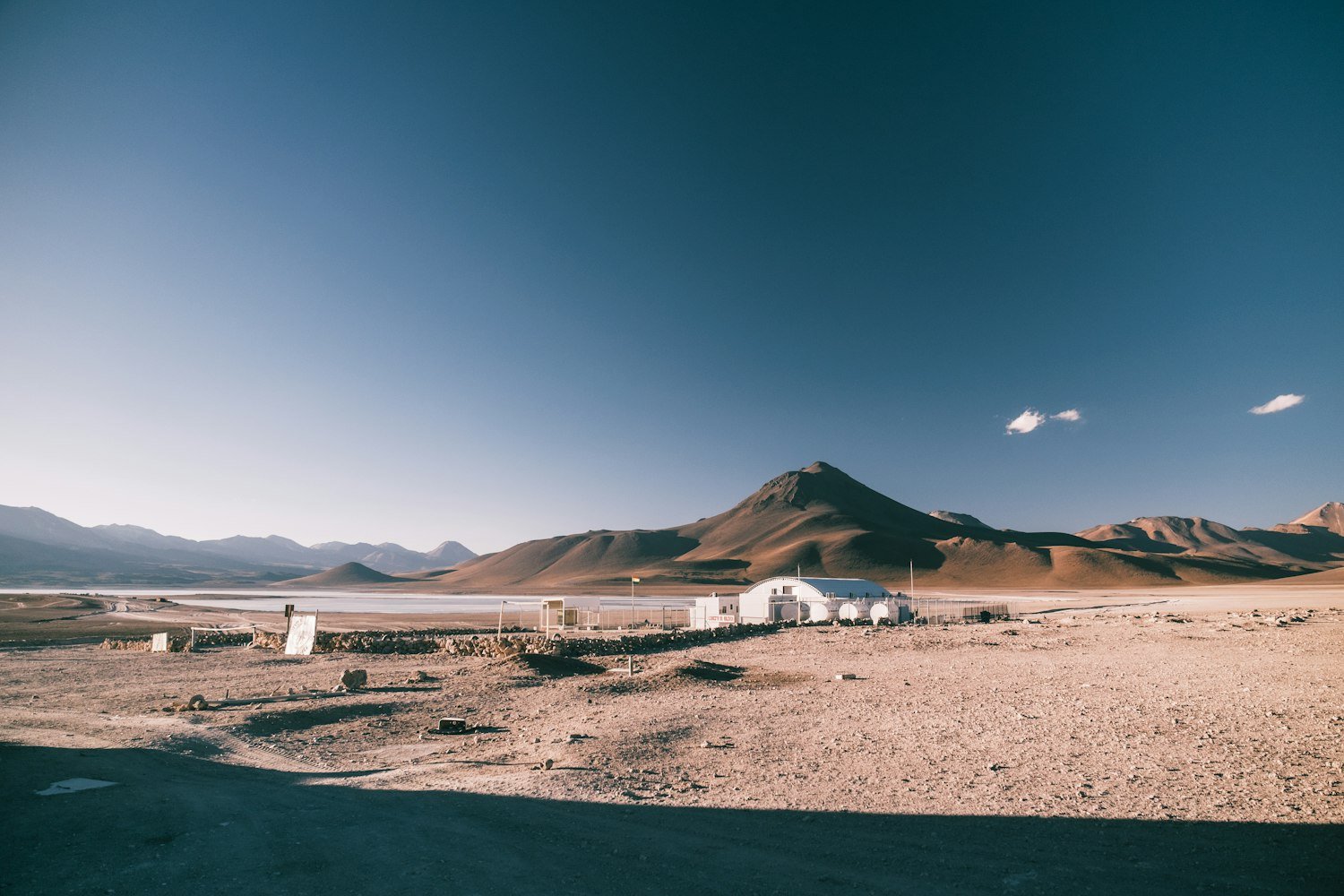 A desert landscape with mountains, representing the Southwest Asia deployment regions covered by the PACT Act