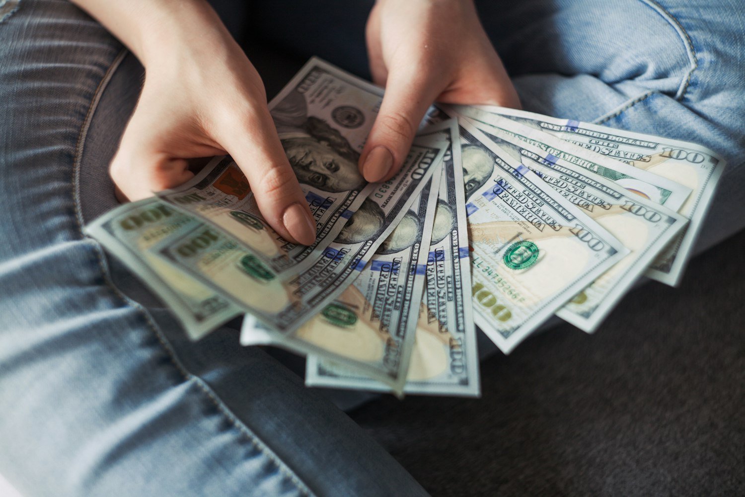 A fan of dollar banknotes, representing restored military retired pay