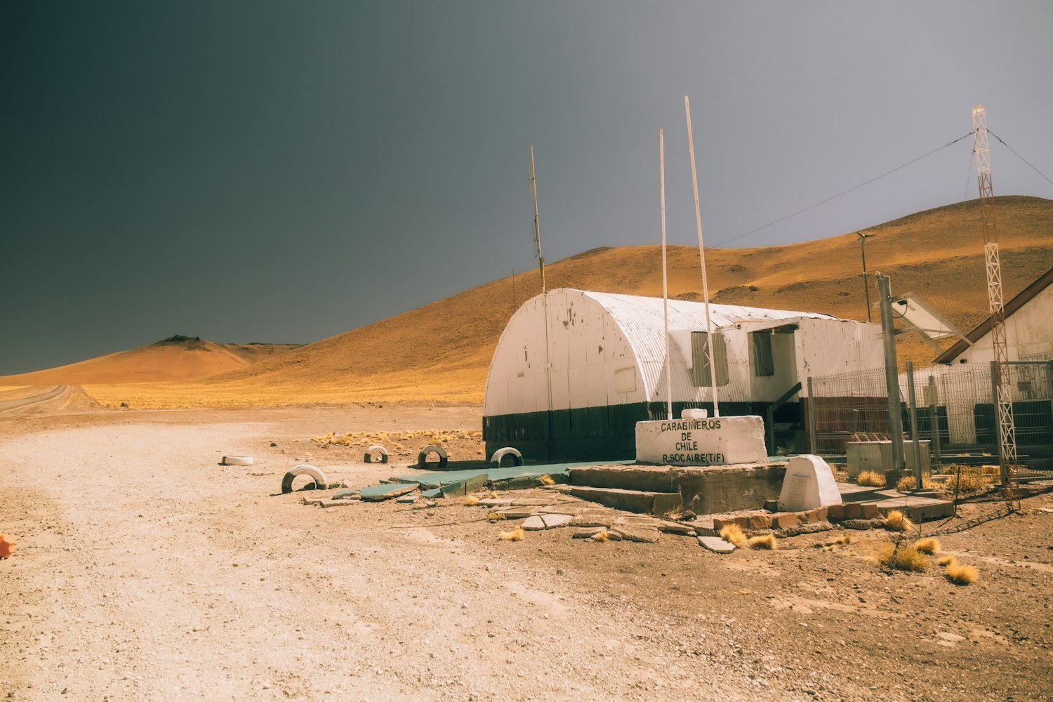 A dusty road beside a building at a remote base location