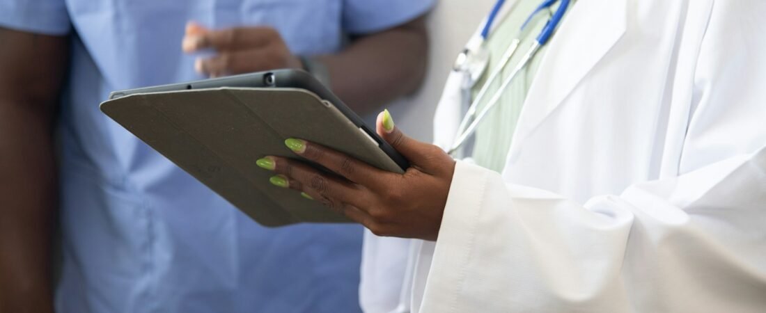 A clinician reviewing records with a patient, as at a VA compensation and pension exam