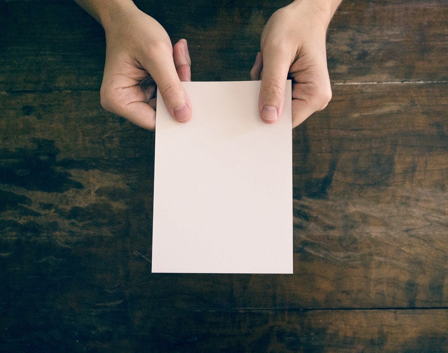 Hands holding a printed letter, representing a benefits decision notice