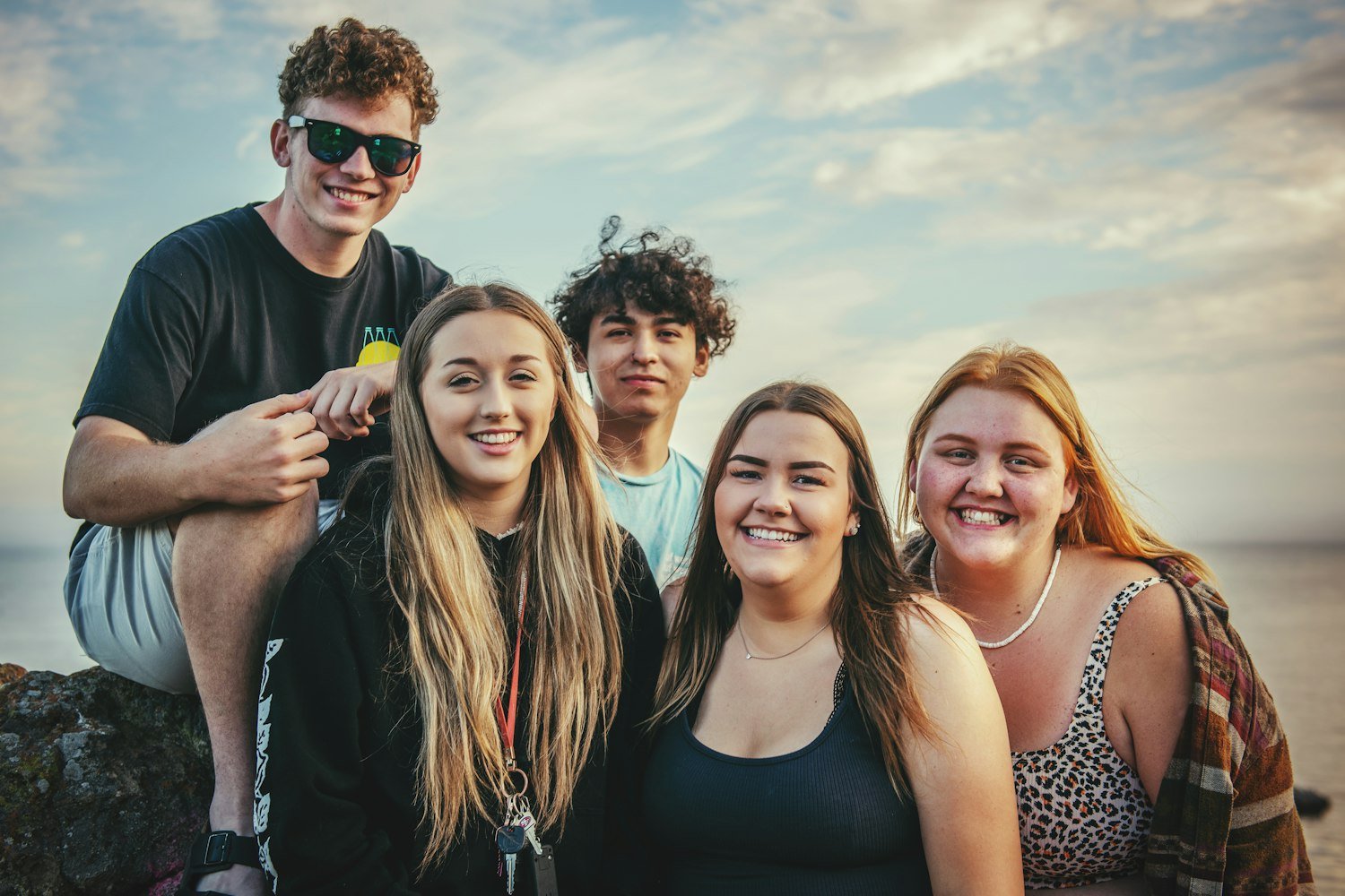 A group of high school students together outdoors, the age group American Legion youth programs serve