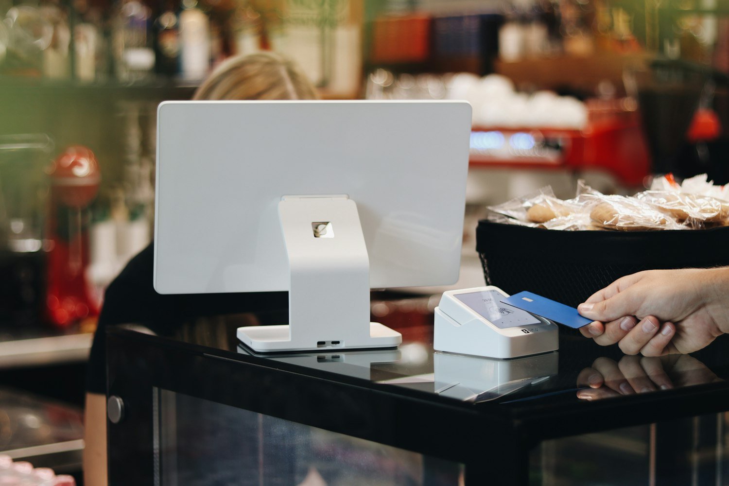 A person holding a credit card, since card payments carry a small commissary user fee