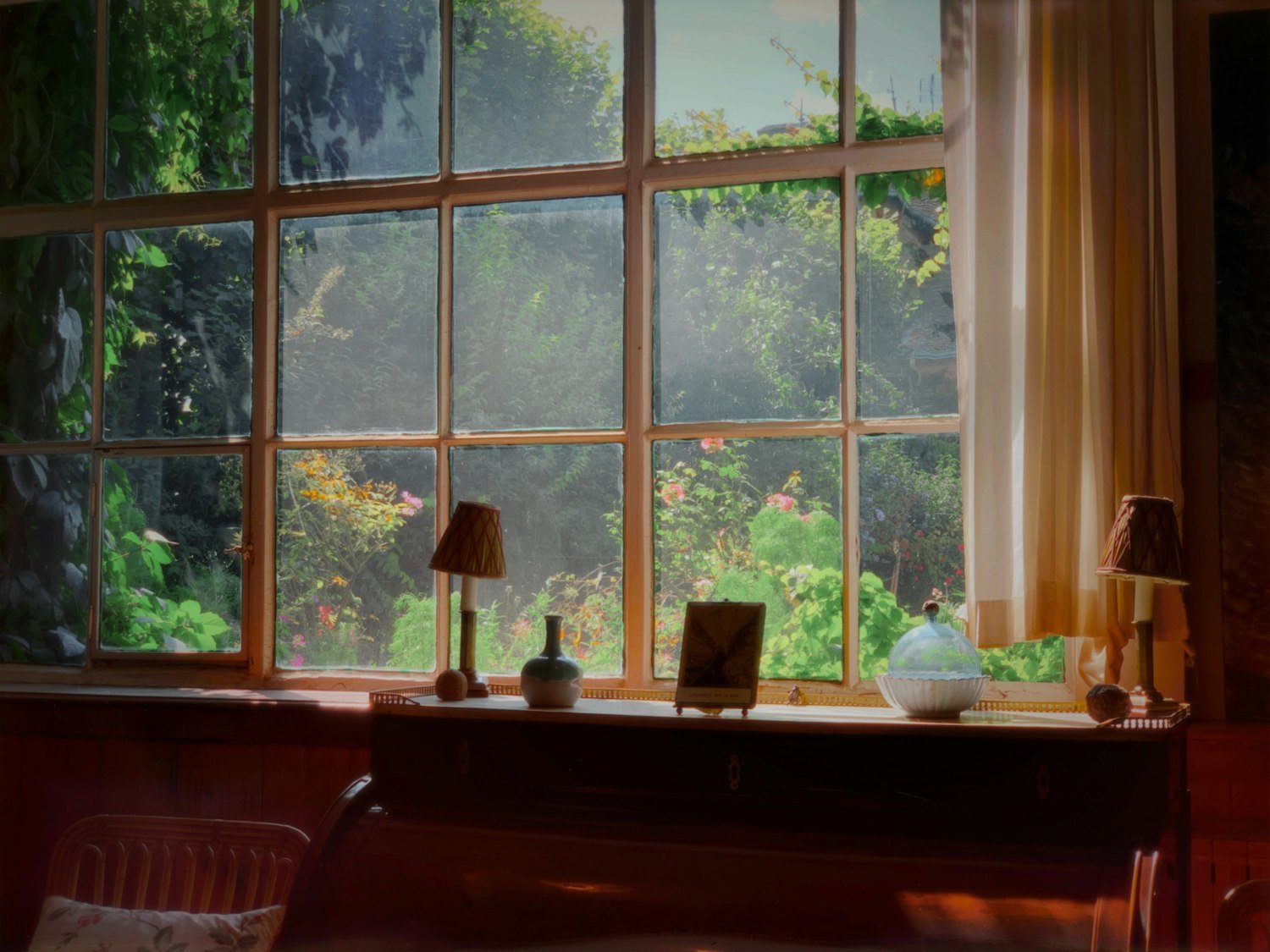 A wooden writing desk beside a window in a hotel room, like the Mayflower Hotel room where the GI Bill was drafted