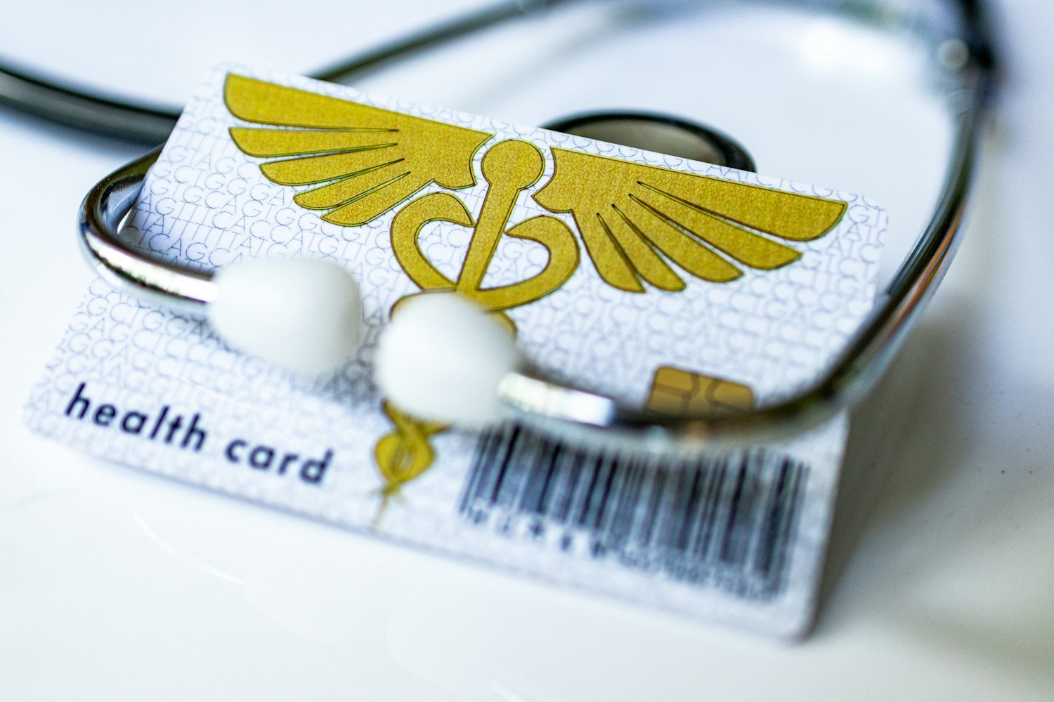 An insurance card beside a stethoscope, representing dental insurance coverage such as VADIP