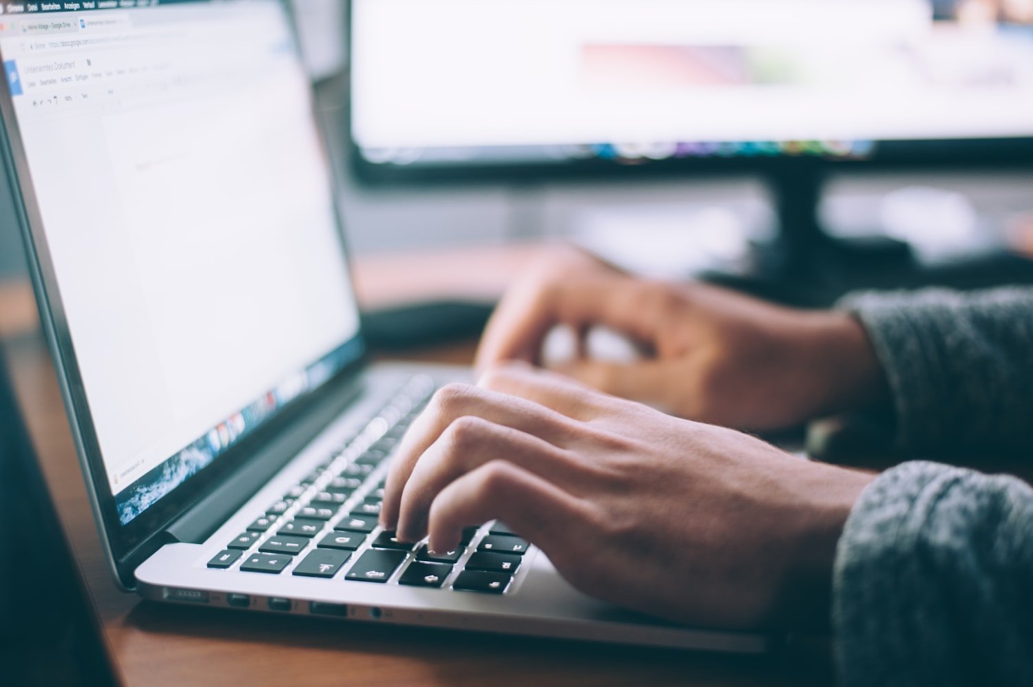 A person using a laptop, as when requesting military records through an online portal