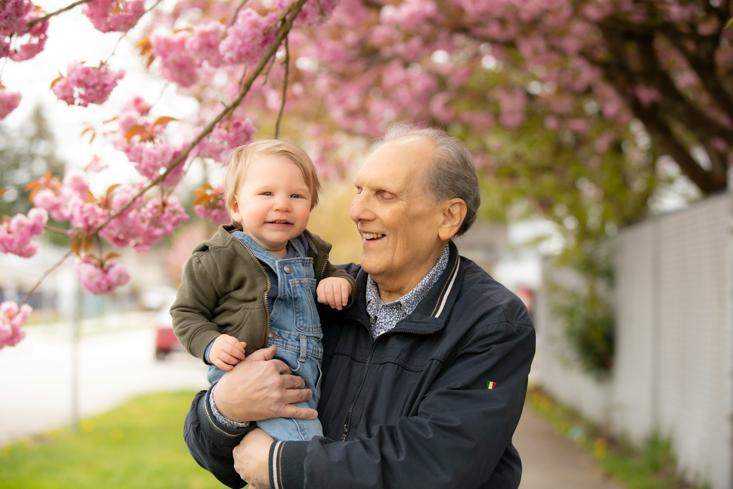 A man holding a young child, representing the dependent children SBP once covered separately