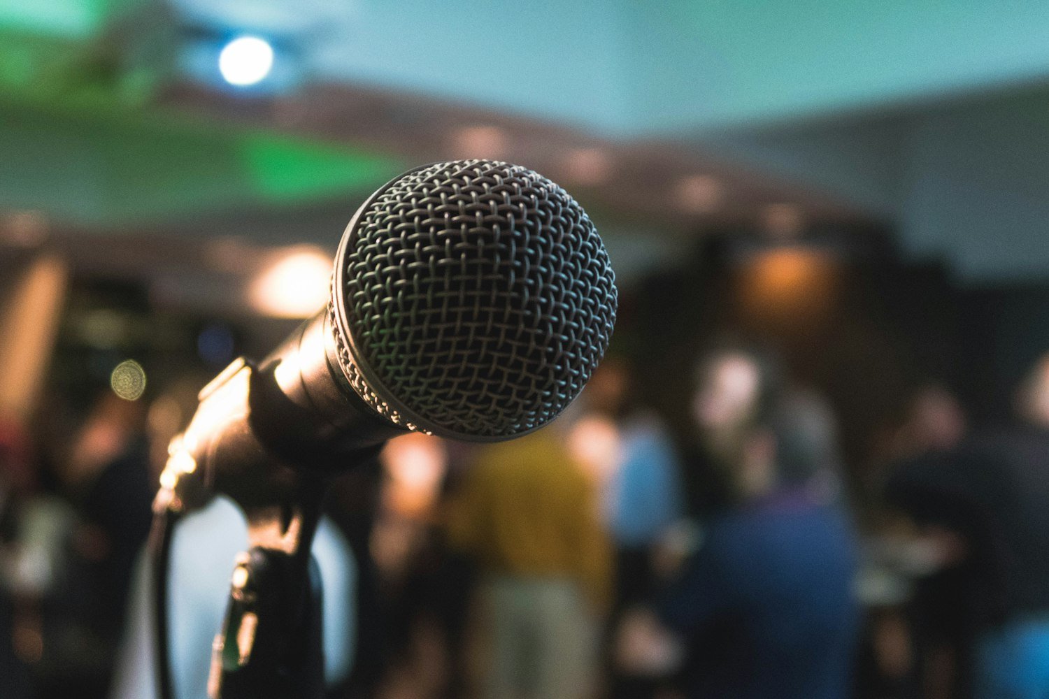 A microphone on a stand, representing the public speaking of the American Legion Oratorical Contest