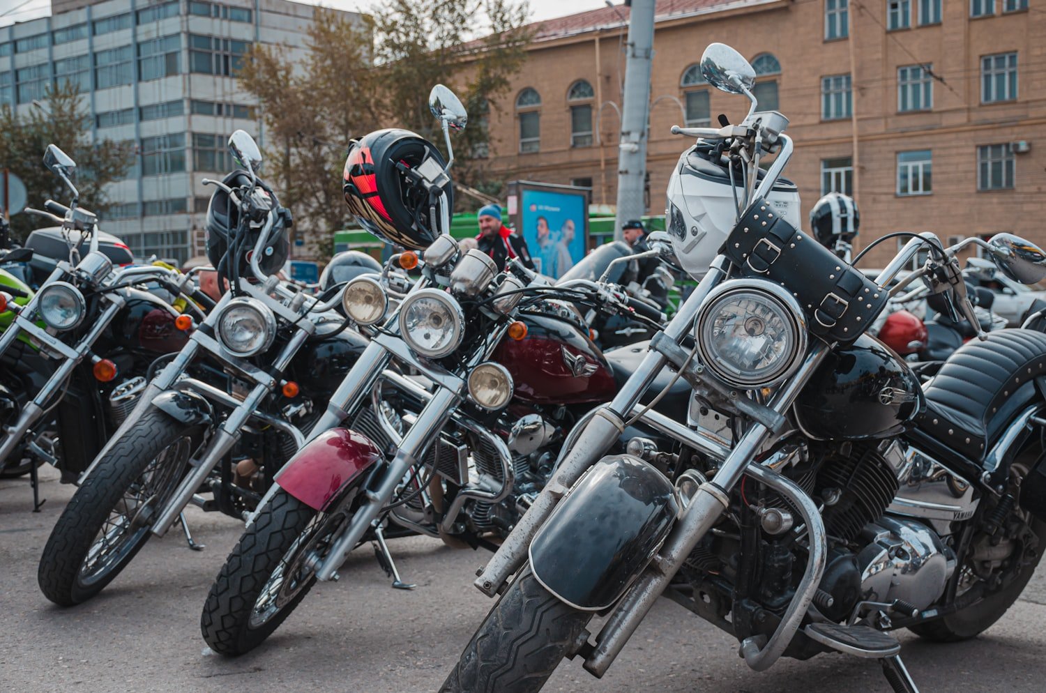 A group of motorcycles parked next to each other at a ride event