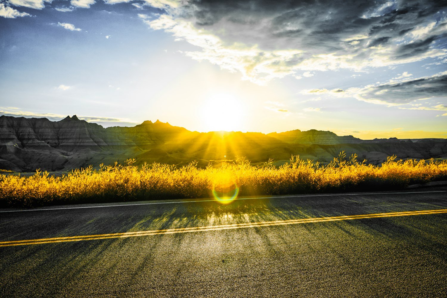An open road stretching ahead under clouds, representing a path forward