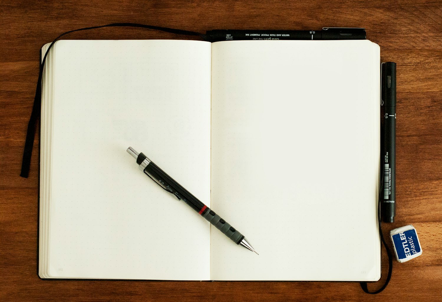 A pen on a blank notebook, for writing notes immediately after a C&P exam