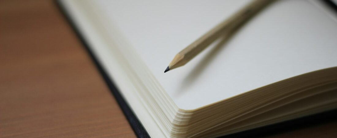 A pencil resting on a notebook, representing working through the VA combined ratings calculation