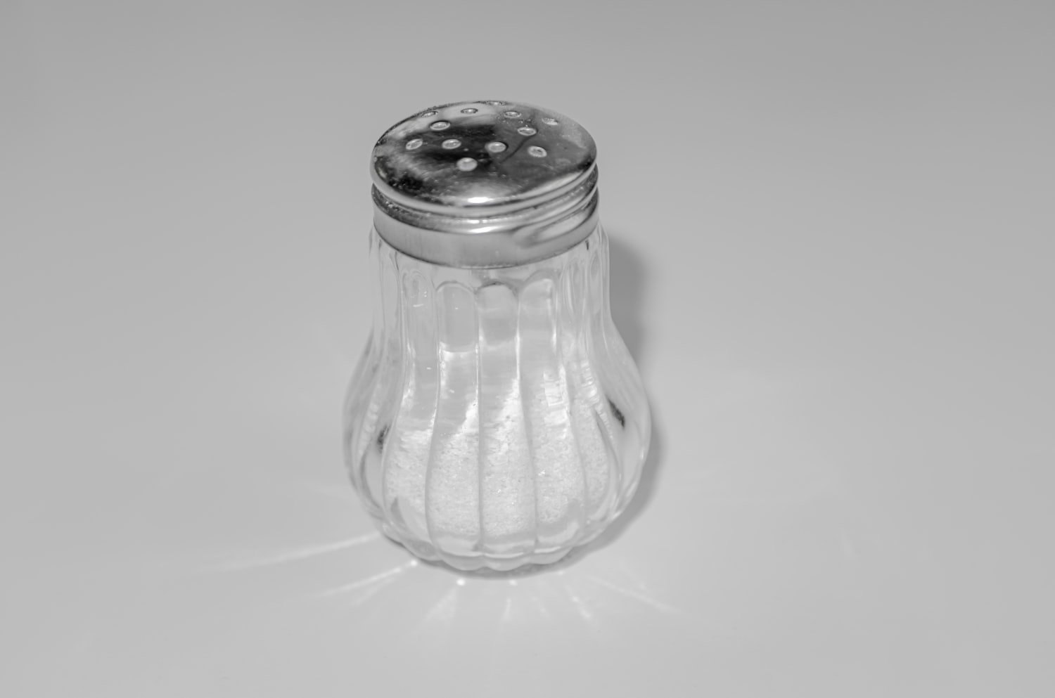 A salt shaker on a table, representing the grains of salt symbolizing families' tears