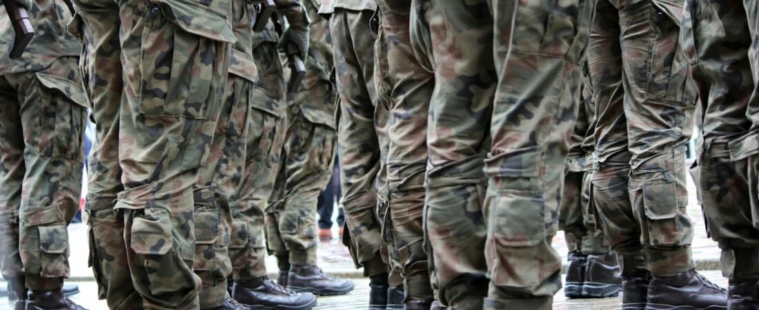 Service members standing together in uniform, the Guard and Reserve members USERRA protects