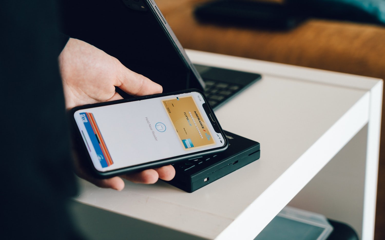 A person holding a smartphone, representing the digital Veteran ID Card