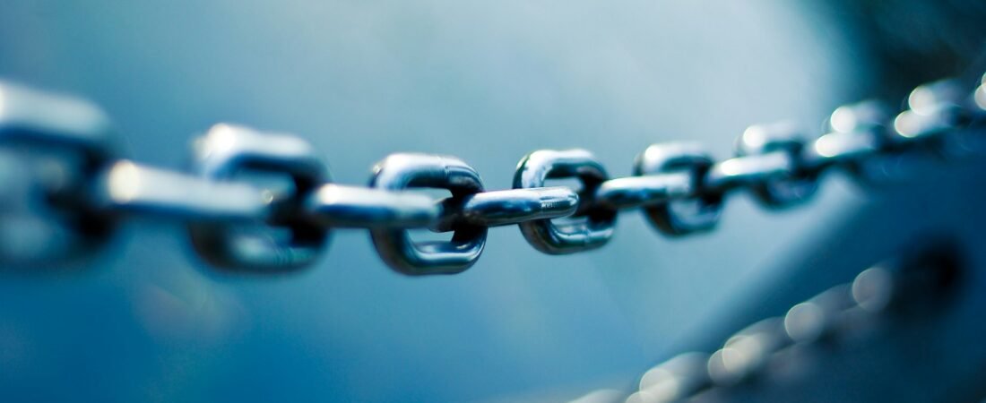 Close-up of steel chain links, representing the causal chain in a secondary service connection claim