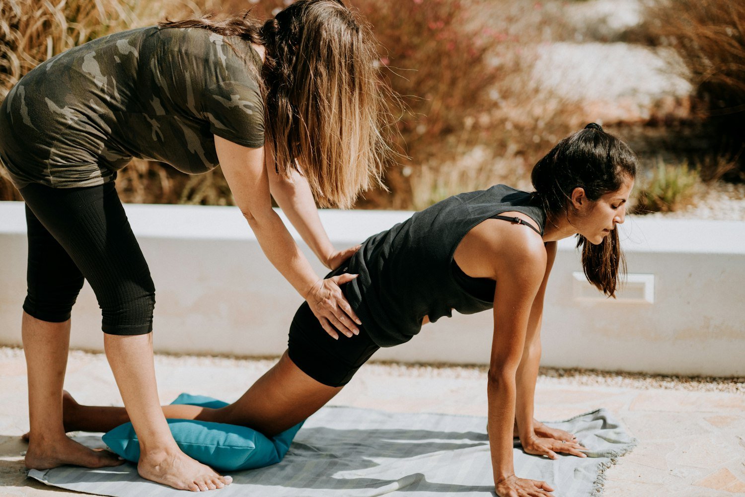 A person stretching on a mat during rehabilitation exercises