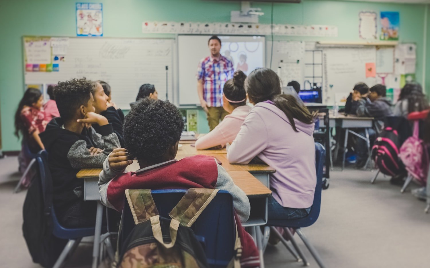 Students in a classroom learning, reflecting the civics education at the heart of ALA Girls State