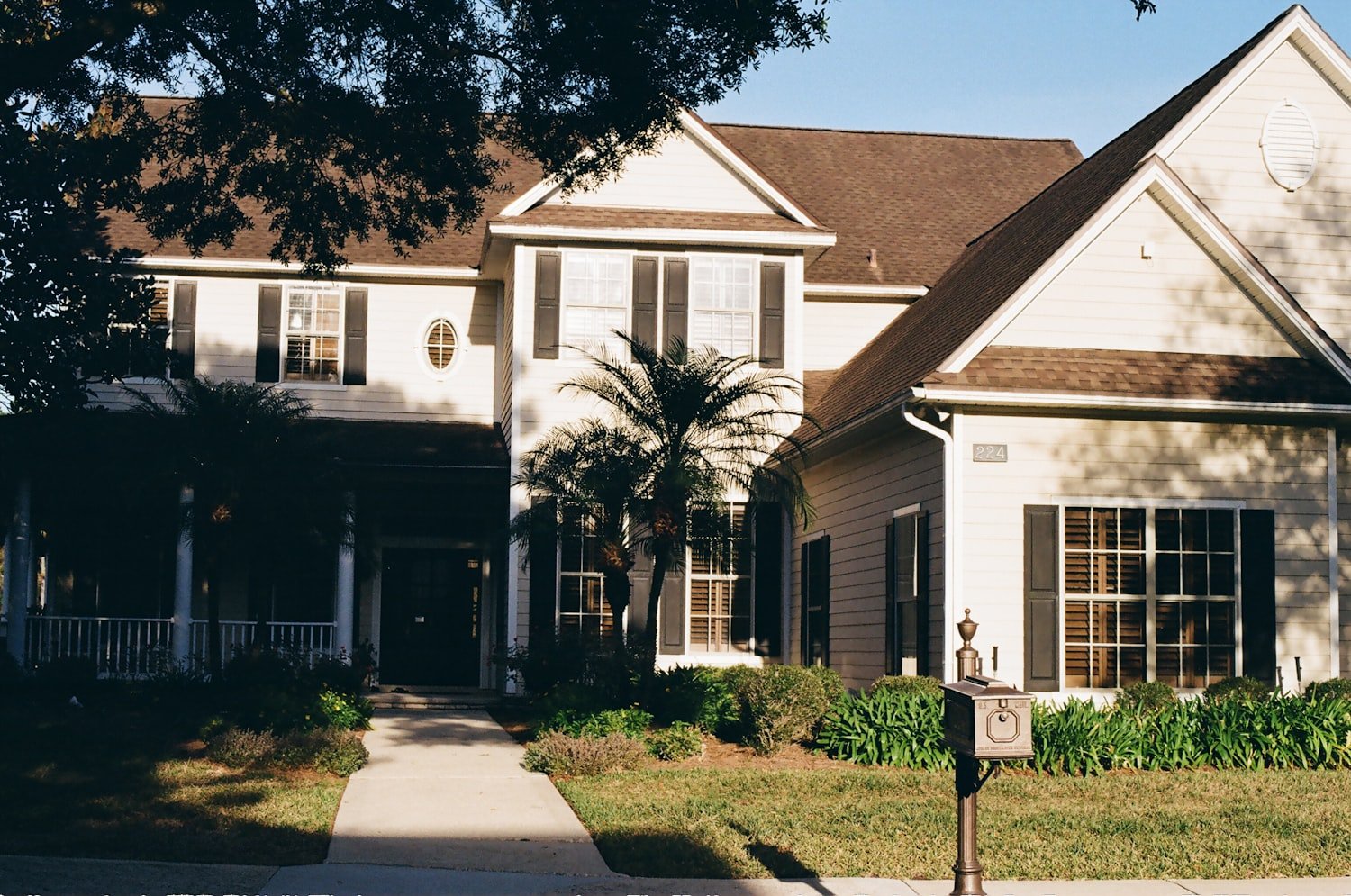 A large two-story house with a covered porch
