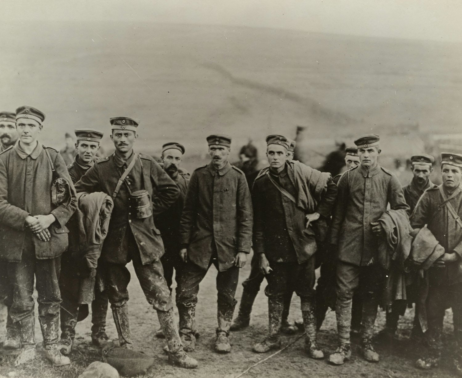 A vintage grayscale photograph of a group of service members, the unit a buddy letter writer served in