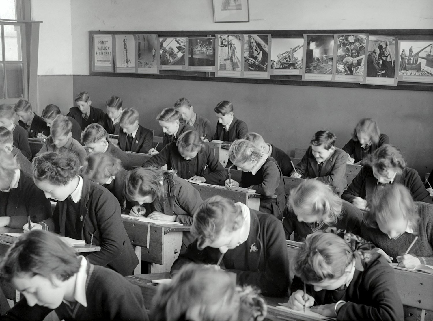 A vintage photograph of students seated in a training class