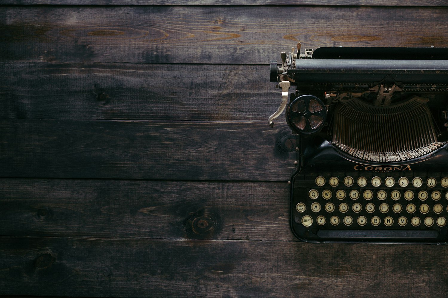 A vintage typewriter on wood planks, evoking the drafting of the Legion's constitution and preamble in 1919