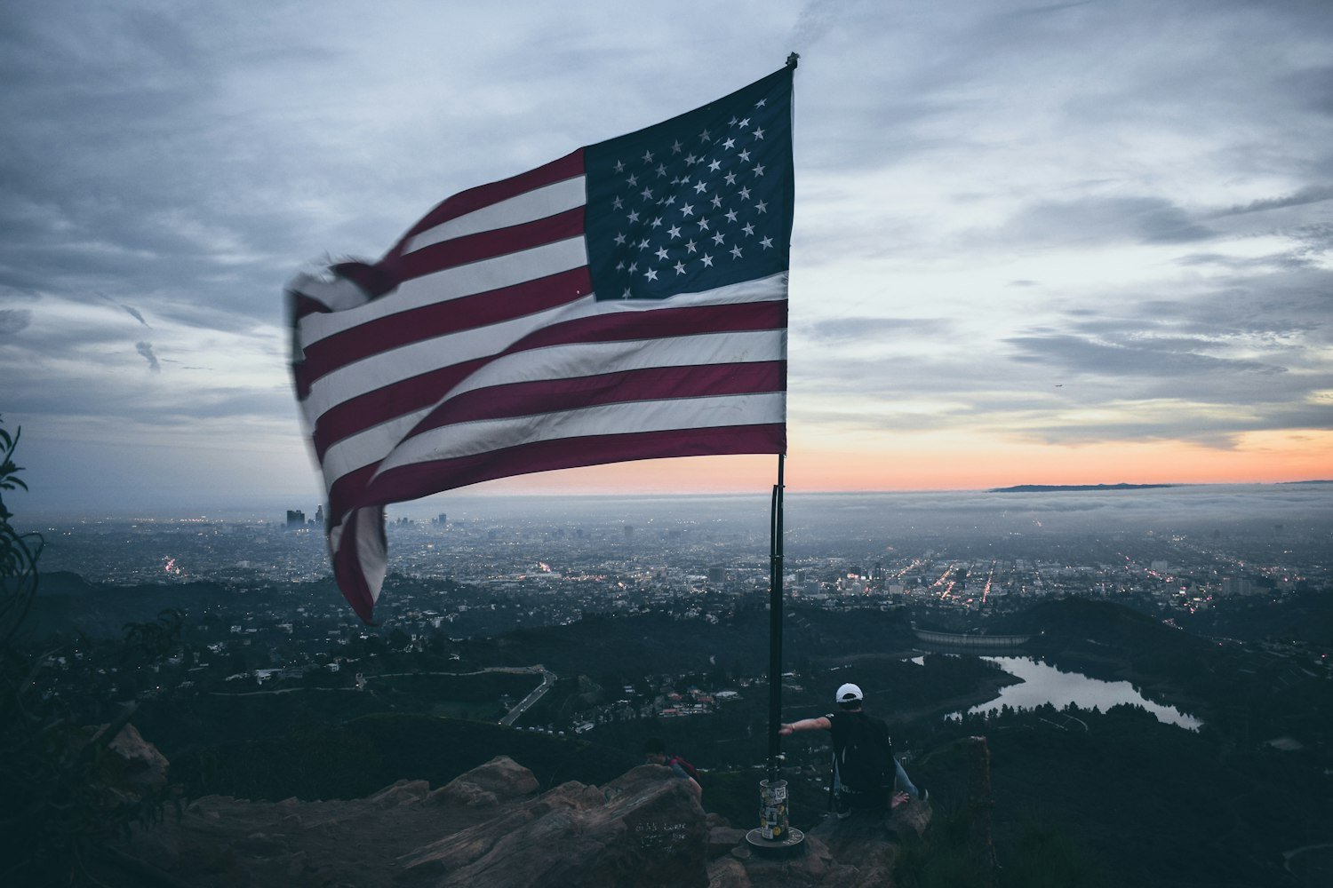 A waving American flag, representing the patriotic mission of Sons of The American Legion