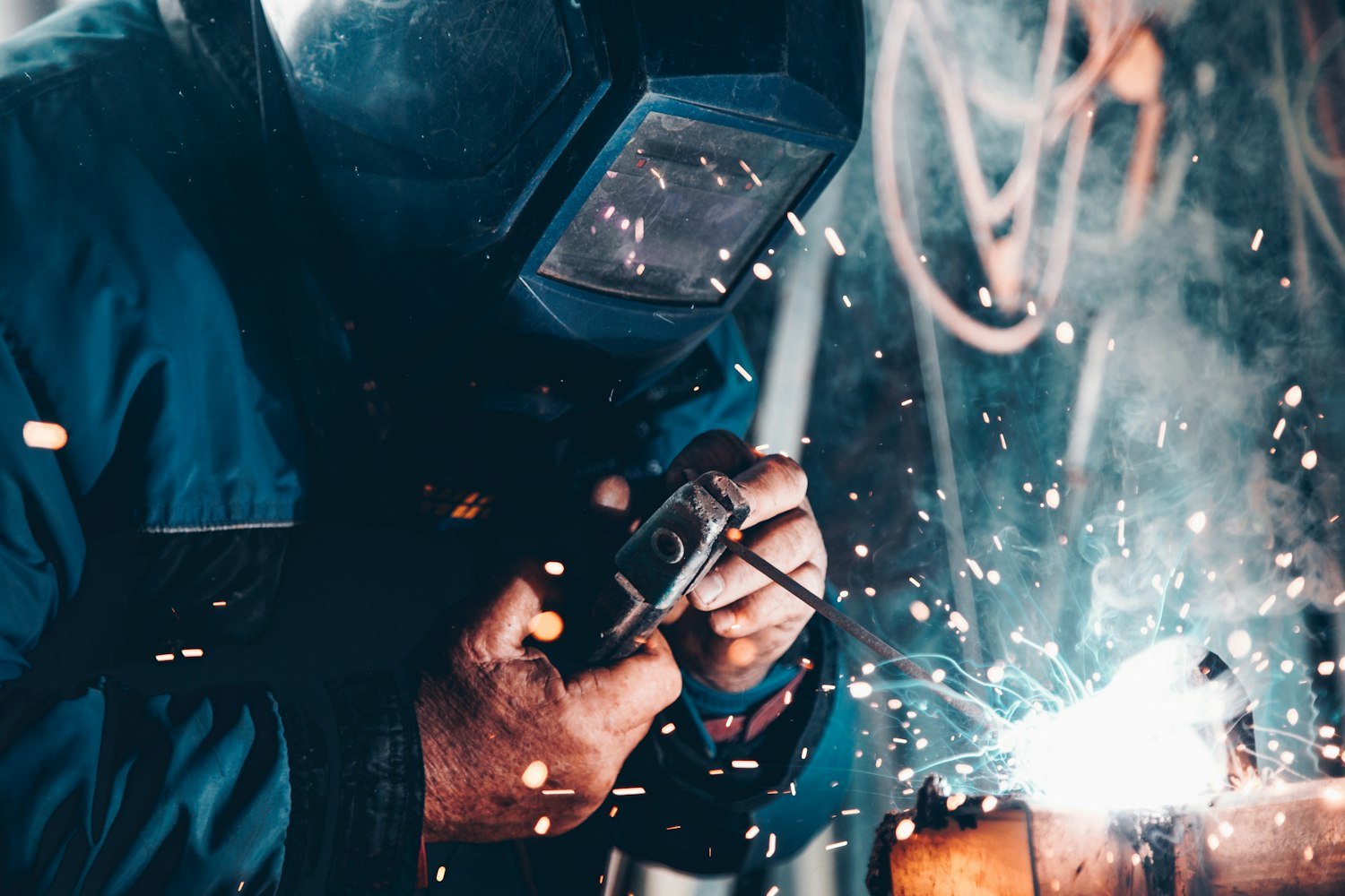 A welder working in a fabrication shop, a skilled trade many veterans enter