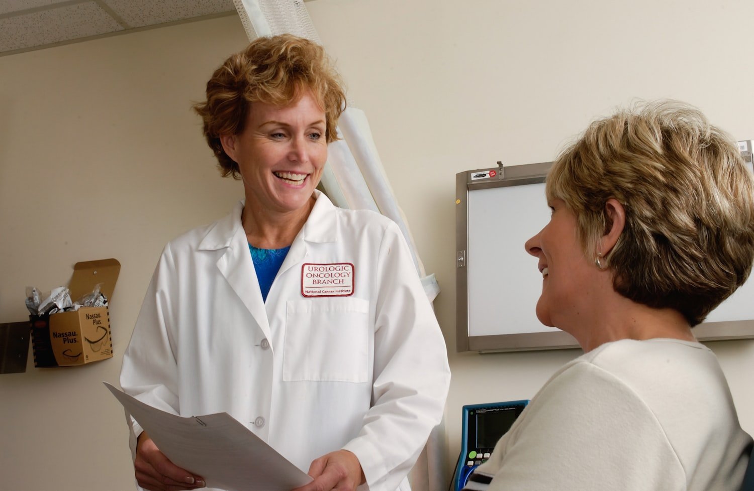 A woman clinician in scrubs, representing VA women's health care services
