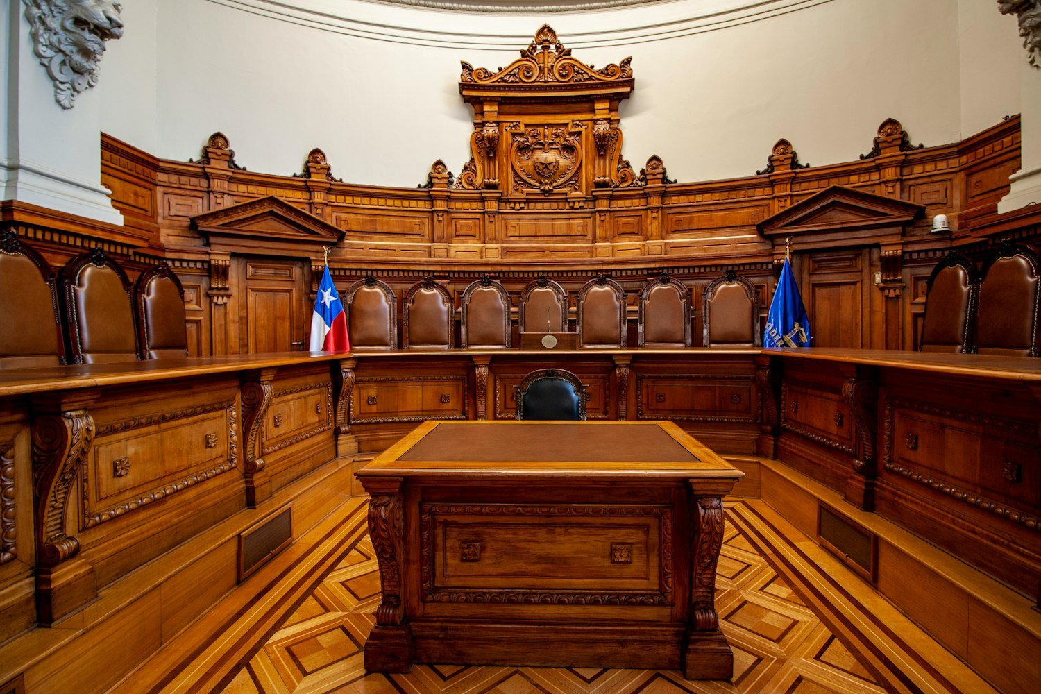 A wooden bench in a hearing room, representing a discharge review board