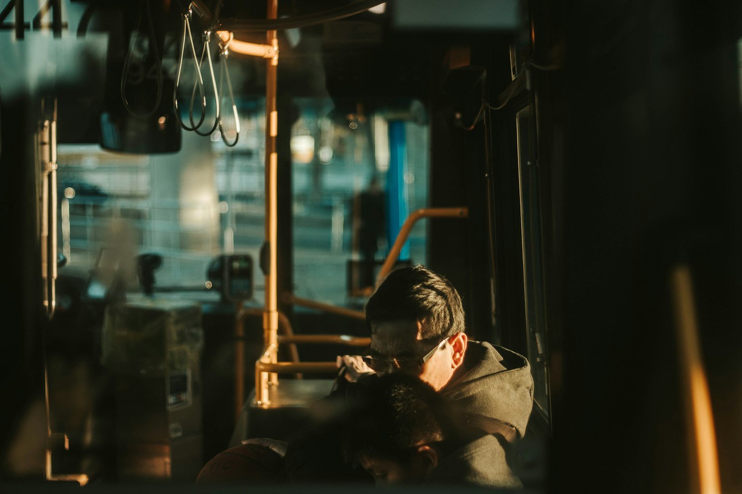 A worker sitting beside a window taking a break, representing reduced capacity for work