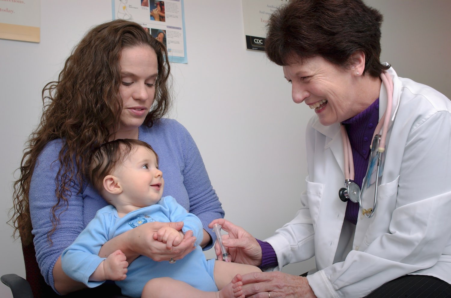 A young child being examined by a doctor during a routine checkup